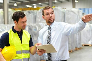 Teamwork - Manager and workmen of a logistics company